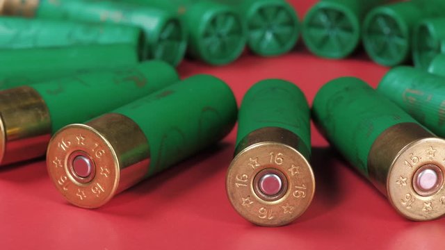 Closeup weathered green ammo cartridges for modern firearm stacked together in rows