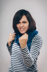 Young woman showing fists