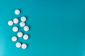 mint candies on a blue background