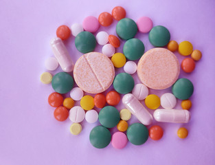 Stack of colourful pills, medicine background
