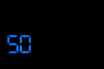 Electronic numbers of 50 blue color on a black background.
