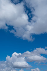 Beautiful cumulus clouds in spring  sunny day, White fluffy cloud floating in blue sky, Cumulus clouds are clouds which have flat bases and are often described as puffy, Horizon background.