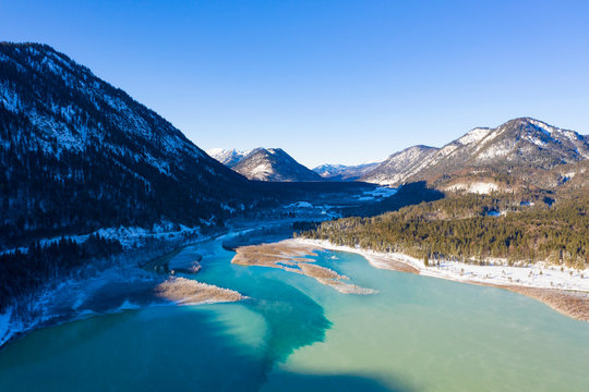 Germany, Bavaria, Lenggries, Drone view of inflow of?Sylvenstein?Dam in winter