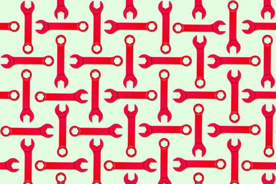 Illustration of rows of red toy wrenches