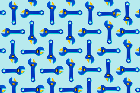 Illustration of rows of blue adjustable toy wrenches