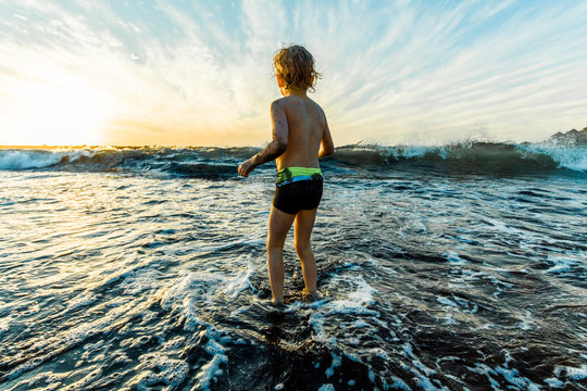 Boy playing at the seafront, Adeje, Tenerife, Canarian Islands, Spain