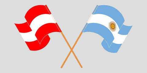 Crossed and waving flags of Argentina and Austria
