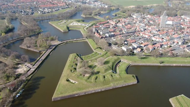 4k aerial video of the medieval Dutch fortress village Naarden with canals and defence walls