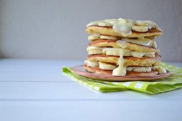Home made pancakes with bananas and custard