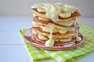 Home made pancakes with bananas and custard