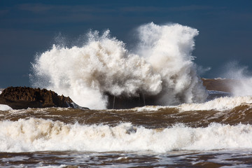 Big waves on a sea with blue background in Essaouira, Morocco.