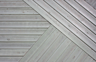 Obraz premium Beautiful gray background from wooden boards connected at an angle. Wood texture
