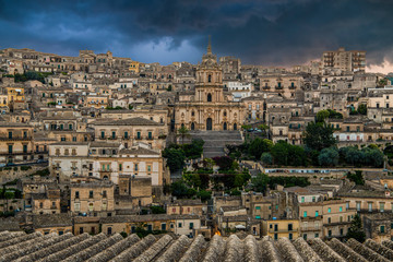 Panoramic view of sicilian baroque town Modica and example of sicilian baroque, Cathedral of Saint...