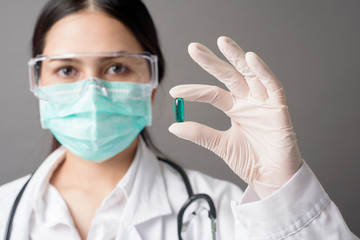 Fototapeta premium Intelligent Doctor is holding medicine pill