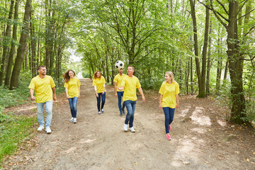 Fototapeta premium Group of young people are playing with a football