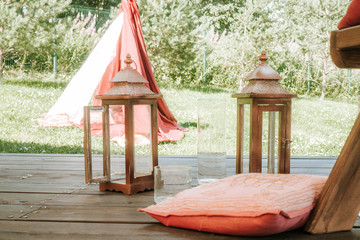 Decor of a chair with a candlestick in a light style near the house
