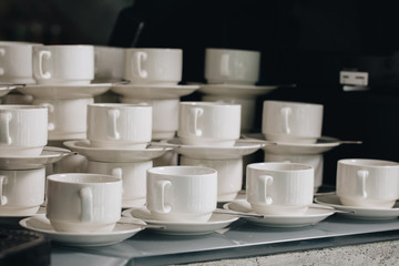 Group of empty coffee cups.Many rows of white cup for service tea or coffee in breakfast or buffet and seminar event. white cup in Catering and Cocktail.