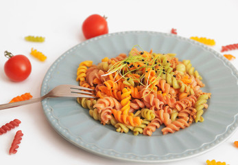 Pasta in white plate decorated for baby. Kid's menu.