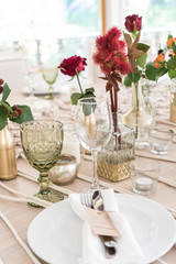 light decor of a festive table in a bright interior