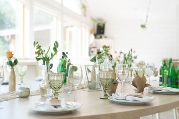 light decor of a festive table in a bright interior
