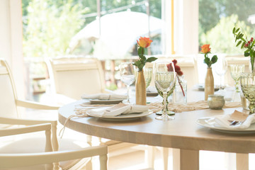 light decor of a festive table in a bright interior