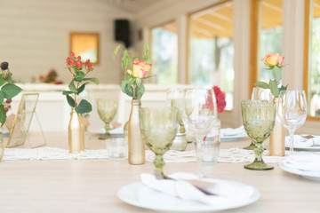 light decor of a festive table in a bright interior