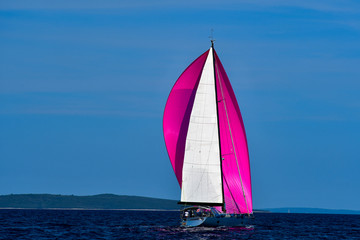 Crimson spinnaker boat
