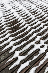 Snow patterns on jetty in winter, Norway. 