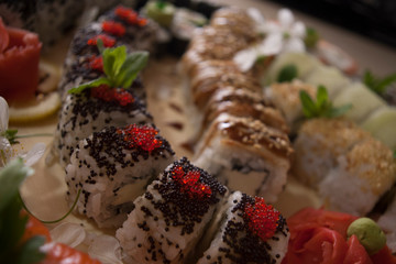 sushi rolls decorated with cherry flowers, food styling