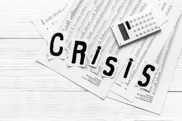 Financial crisis concept with gavel - debt, bankruptcy - on white wooden background top view