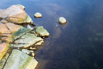 Pink-green rocks in the water
