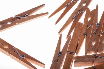 Wooden clothes pins with wire spring.