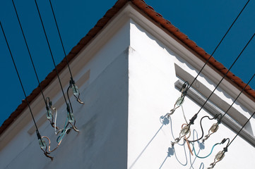 steel cables at an electric substation with glass insulators