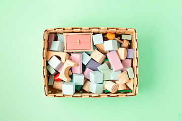 Flat lay with wooden  blocks in pastel colors. Eco friendly, zero waste, plastic free, educational, gender neutral toys for children