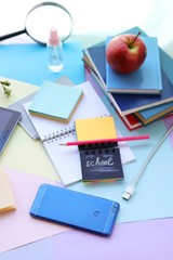 School stationery, tablet, phone on the desk, home schooling concept, part interior children's room, back to school