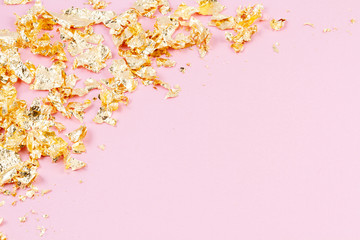 Frame with golden shimmer glitter over the pink pastel background