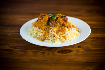 boiled vermicelli with meat and gravy in a plate
