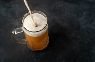 pour beer into a beer glass