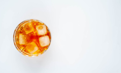 glass with whiskey on a white background