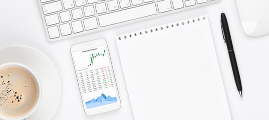 Office desk table with computer, supplies and coffee cup