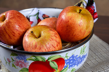 natural and healthy tropical fruit apple in the bowl on the table on blurred texture background