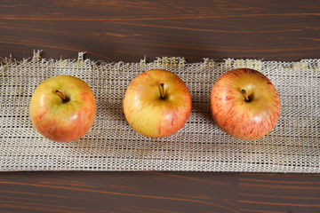 natural and healthy tropical fruit apple on the table on blurred texture background
