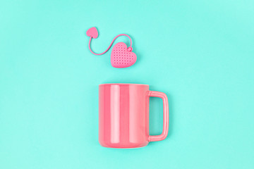 Flat lay with heart shaped tea bag and cup. Waking up, morning tea, every day rituals, zen attitude, destress, healthy drink, love idea
