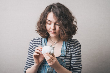 Young woman with piggy bank