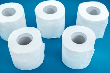 rolls of toilet paper on a blue background