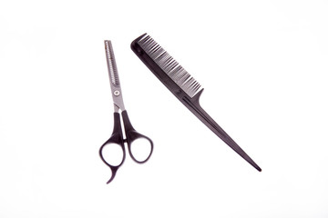 Black comb and thinning scissors