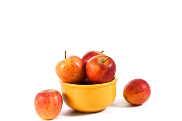 natural and healthy apples tropical fruit inside a yellow pot isolated on bench background.