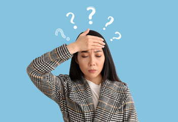 Asian woman suffering from high temperature on color background. Concept of coronavirus  epidemic