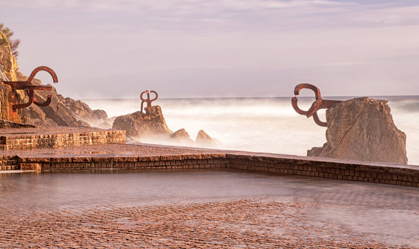 SAN SEBASTIAN, SPAIN - 7 MAY, 2019: "Peine del Viento" set of sculptures of Eduardo Chillida located at the beach of San Sebastian, Spain