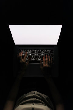 Developer woman working at night at home, with her laptop.